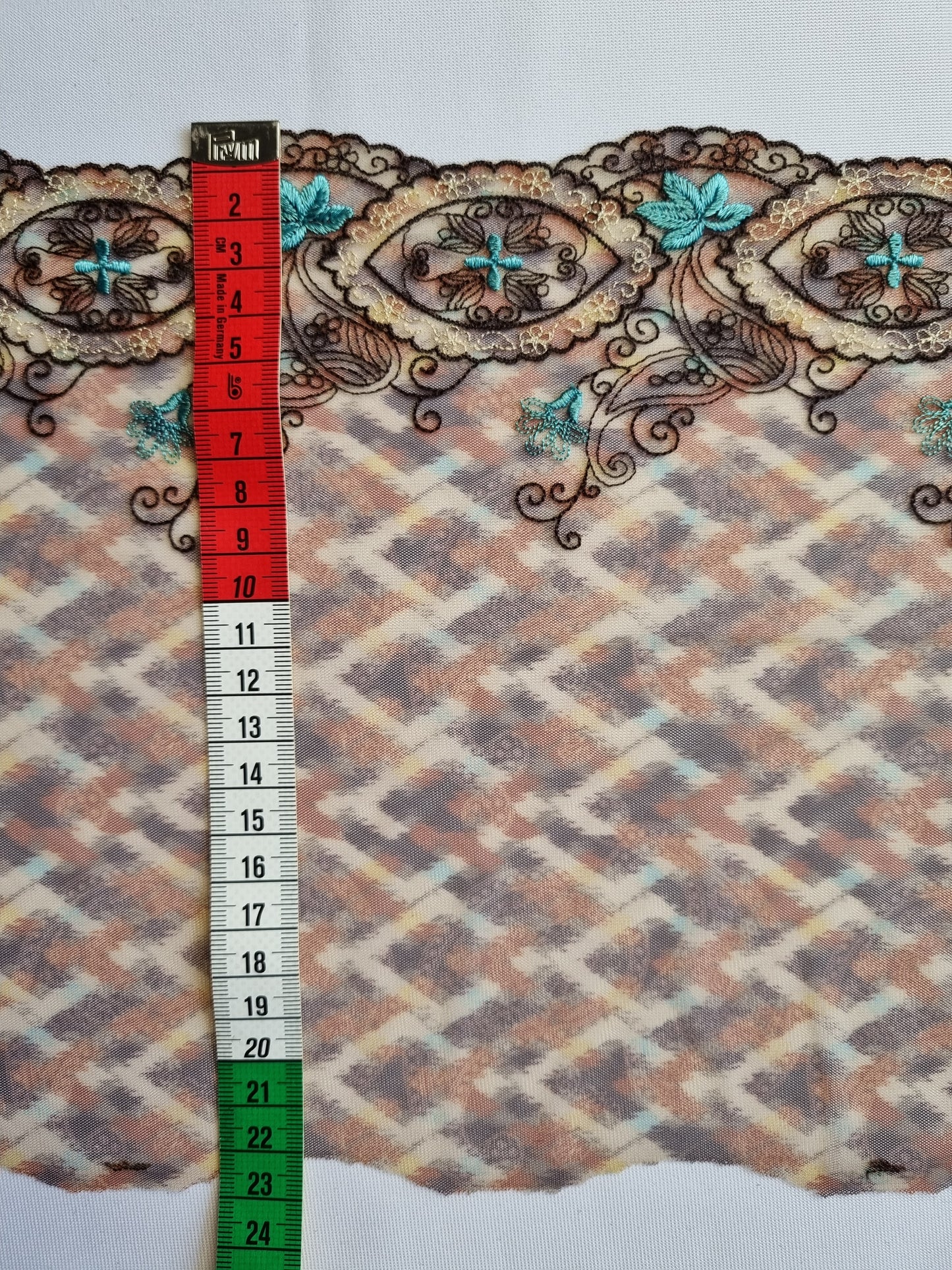 Bruin tule kant met retro print en borduursel in turquoise en bruin