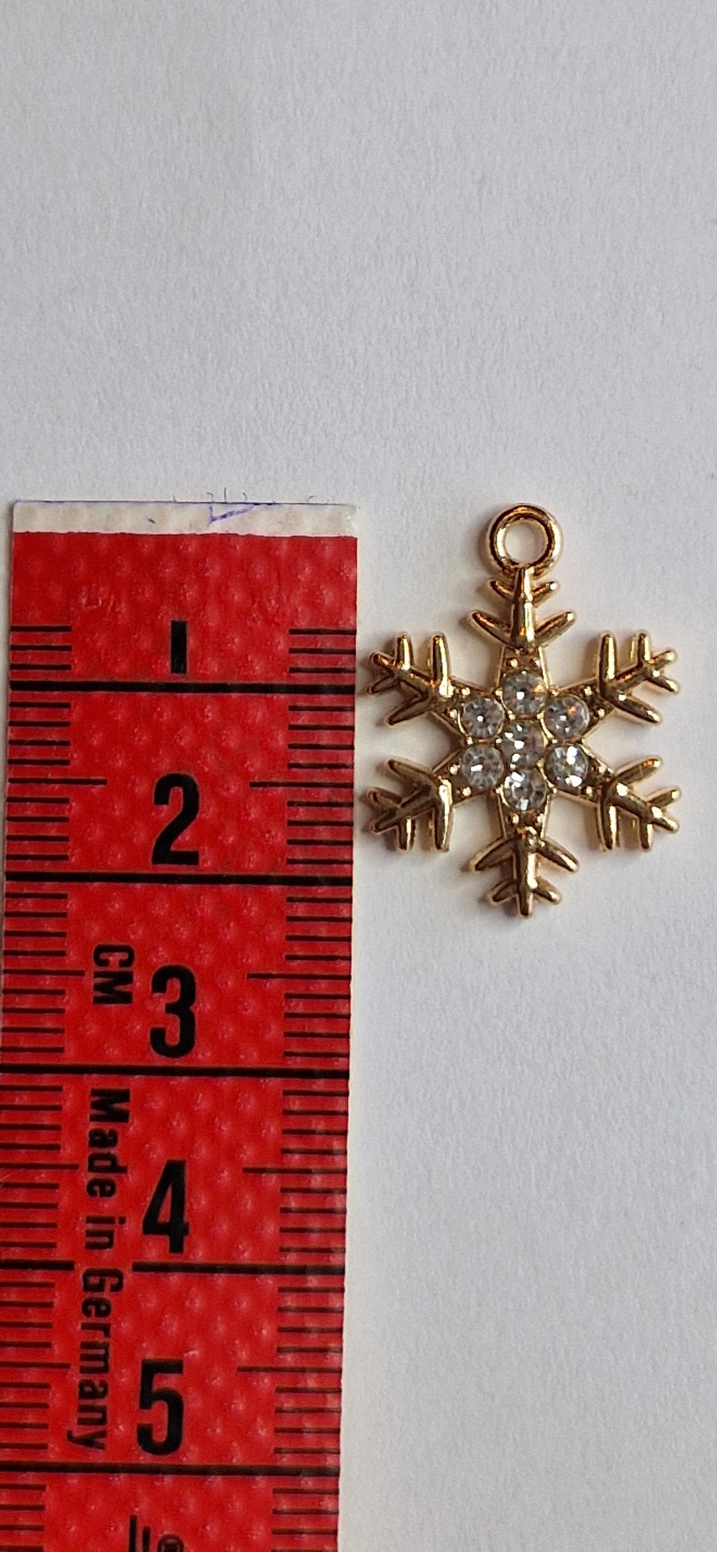 goudkleurig bedeltje van sneeuwvlok met zirconiatjes