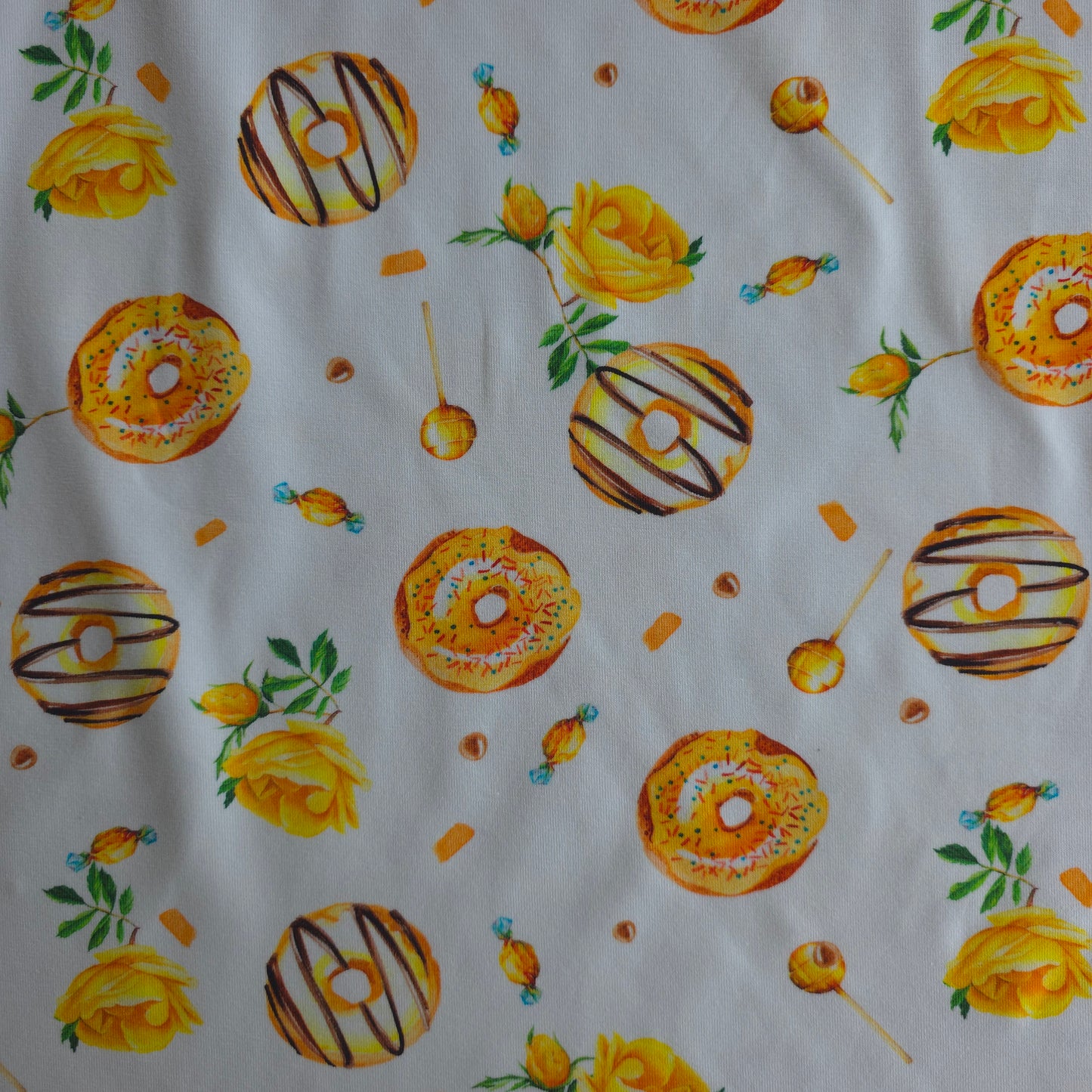 Mierzoete katoen tricot/jersey met donuts, lolly's en roosjes