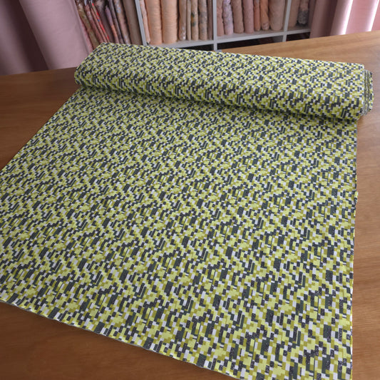katoen tricot/jersey met geometrisch design in groentinten, voorzien van zilverkleurig glittertje